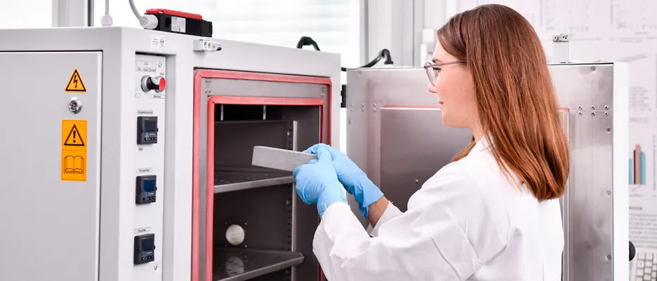 Scientist puts a piece of concrete in the furnace